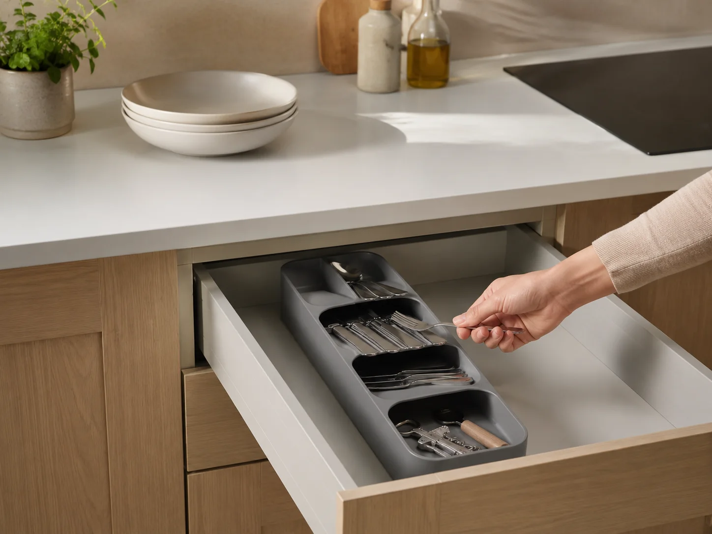 Joseph Joseph DrawerStore Compact holding cutlery inside an open kitchen drawer